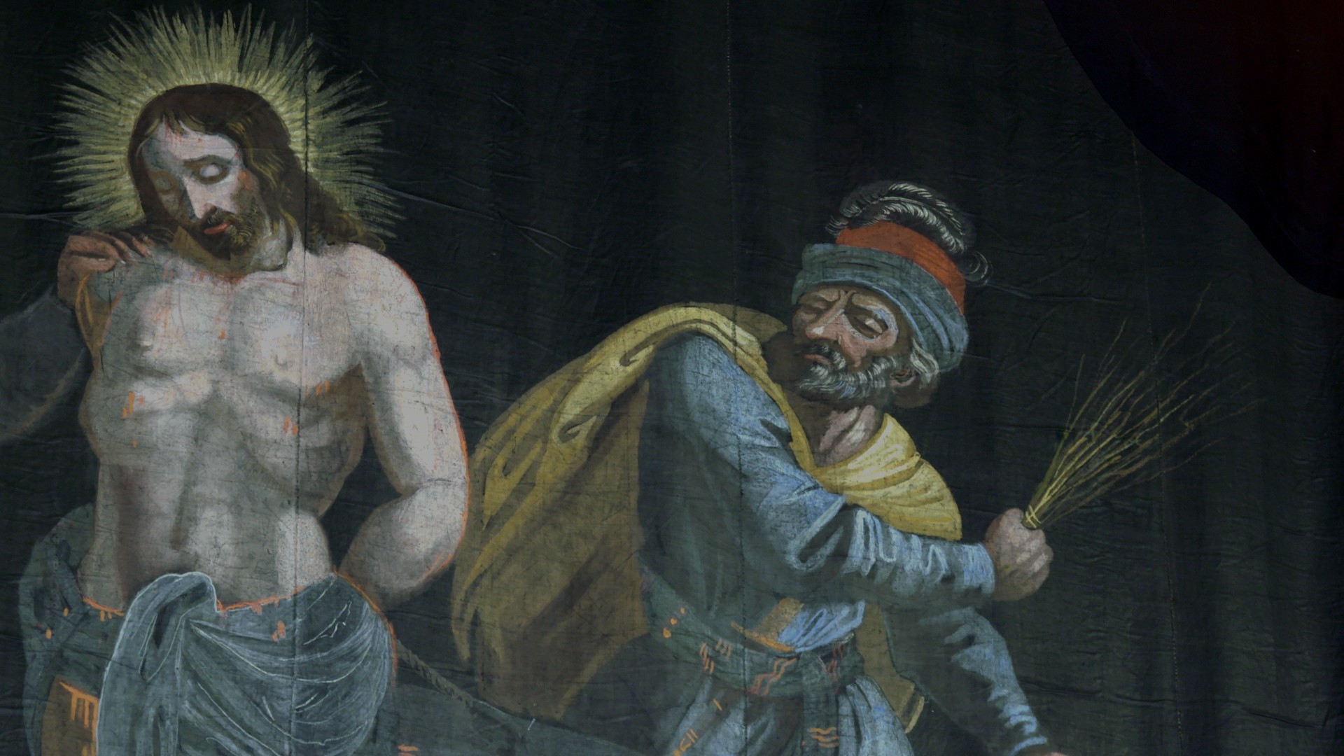 fragment sceny biczowania. Wizerunek Chrystusa oraz mężczyzny wykonującego zamach dłonią, w której trzyma rózgę.